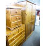 PINE DOUBLE WARDROBE; A PINE DOUBLE BEDSTEAD WITH FRAME; A PINE CHEST OF TWO SHORT OVER FOUR LONG