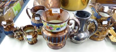 SIX VICTORIAN COPPER LUSTRE POTTERY JUGS, including a pedestal example, and a PLATINUM LUSTRE