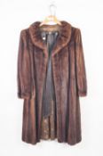 LADY'S FULL-LENGTH BROWN MINK COAT with shawl collar, slit pockets, hook fastening front