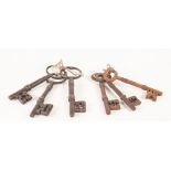 THREE VERY SIMILAR LARGE ANTIQUE STEEL KEYS each approx 5 1/2" (14cm) long, age patinated and