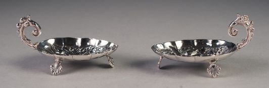 PAIR OF UNMARKED FOREIGN SILVER COLOURED METAL SMALL DISHES, each with repousse 'berry spoon'