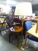 AN EDWARDIAN INLAID MAHOGANY CIRCULAR OCCASIONAL TABLE WITH UNDERTIER AND A BRASS ELECTRIC