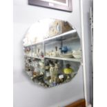 AN ART DECO FRAMELESS WALL MIRROR WITH FANCY CUT AND BEVELLED EDGES, PLATED MOUNTS, 20" X 20"