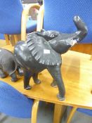 A LARGE MODEL OF AN ELEPHANT WITH TRUNK RAISED (A.F.)