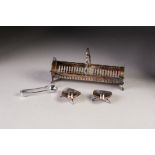 A SILVER PLATE DEMI CYLINDRICAL BASKET, with cut card decoration having solid raised ends and