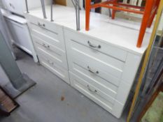 A PAIR OF WHITE MELAMINE THREE DRAWER CHESTS OF DRAWERS AND A PAIR OF WHITE FINISH BEDSIDE CHESTS OF