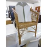 A CREAM FRAMED DRESSING MIRROR AND CANE TUB ARMCHAIR (2)