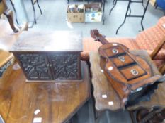 A MINIATURE CARVED OAK TWO DOOR CABINET, AND A SMALL CHEST OF THREE DRAWERS IN THE FORM OF A