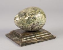 GREEN ONYX EGG ON OBLONG STAND PAPERWEIGHT