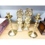 PAIR OF EARLY TWENTIETH CENTURY BRASS ANDIRONS IN THE FORM OF STYLIZED SEATED LIONS, 10" (25.4cm)