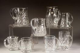 FIVE CUT GLASS JUGS, 7 ¼" (18.4cm) high and smaller, together with THREE CUT GLASS MUGS, 5 ½" (14cm)