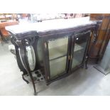 A VICTORIAN DISPLAY CABINET WITH TWO GLAZED CENTRAL DOORS, FLANKED BY TWO OPEN SECTIONS WITH OVAL