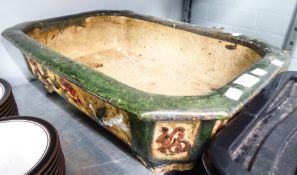 A LARGE OBLONG POTTERY JARDINIERE