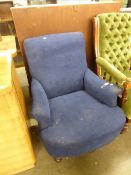 A VICTORIAN LOW ARMCHAIR, ON TURNED FRONT SUPPORTS, COVERED IN BLUE FABRIC