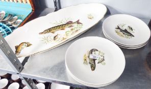 POST-WAR FRENCH PORCELAIN FISH SERVING SET OF SIX PLATES AND A LARGE ELLIPTICAL FISH DISH, EACH