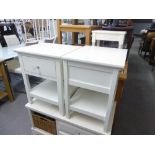 A PAIR OF WHITE FINISH TWO TIER SQUARE LAMP TABLES, EACH WITH A DRAWER AND ANOTHER SMALL WHITE