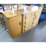 AN ART DECO DINING ROOM SUITE COMPRISING OF A BREAKFRONT SIDEBOARD OF FOUR GRADUATED CENTRAL