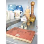 A ROUEN 24 POSTCARD BOOK A CARVED WOODEN BIRD ON A BRANCH AND A SOUVENIR BOTTLE OF SARDEGNA