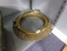 HEAVY CAST BRASS SHIPS PORTHOLE, of conventional design but lacking hinge pin, fastening pieces