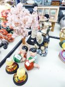 SIX ORIENTAL FIGURAL ORNAMENTS AND A MODEL TREE