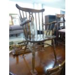 SET OF SIX HARDWOOD COMB BACKED WINDSOR DINING CHAIRS WITH PANEL SEATS, INCLUDING THE CARVER'S