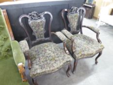 A MATCHING PAIR OF MAHOGANY DRAWING ROOM ARMCHAIRS WITH FLORAL PATTERN OVERSTUFFED SEATS AND BACKS