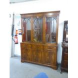 A MODERN REPRODUCTION MAHOGANY BOOKCASE, WITH ASTRAGAL GLASS UPPER SECTION, DRAWERS AND CUPBOARDS