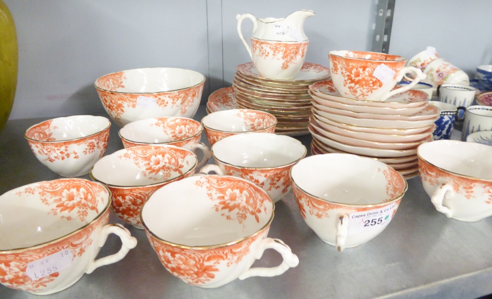 A 38 PIECE LATE VICTORIAN PORCELAIN TEA SERVICE, TRANSFER PRINTED IN BRICK RED (38)