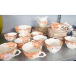 A 38 PIECE LATE VICTORIAN PORCELAIN TEA SERVICE, TRANSFER PRINTED IN BRICK RED (38)