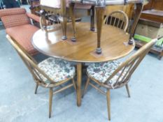 AN ERCOL OVAL DROP LEAF DINING TABLE, TOGETHER WITH A SET OF FOUR ERCOL STICK BACK CHAIRS (5)