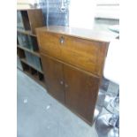 A MID TWENTIETH CENTURY OAK SIMPLISTIC BUREAU, OF FALL-FRONT OVER TWO DOOR CUPBOARD