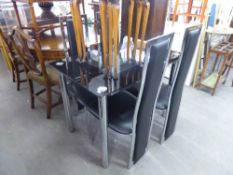 A MODERN GLASS AND CHROME DINING TABLE WITH FOUR BLACK LEATHER BACK AND SEATED CHAIRS (5)