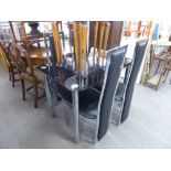 A MODERN GLASS AND CHROME DINING TABLE WITH FOUR BLACK LEATHER BACK AND SEATED CHAIRS (5)