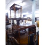 A MODERN REPRODUCTION MAHOGANY COFFEE TABLE AND A NEST OF THREE TABLES (2)