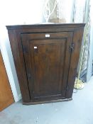 VICTORIAN OAK CORNER CUPBOARD HAVING SOLID PANEL DOOR ENCLOSED THREE SHAPED SHELVES