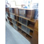 TWO UNIX' THREE SECTION OAK BOOKCASES AND TWO SMALLER SECTIONS (ALL WITH GLASS SLIDING DOORS)