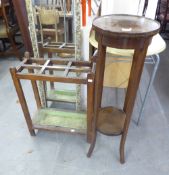 AN EDWARDIAN INLAID MAHOGANY CIRCULAR PLANT STAND, ALSO AN OAK UMBRELLA STAND (2)