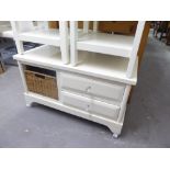 A WHITE FINISH COFFEE TABLE WITH TWO DRAWERS AND A WICKER BASKET