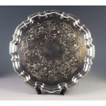MODERN CHIPPENDALE STYLE ELECTROPLATED TRAY, of circular form with wavy outline and foliate scroll
