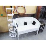 A TALL WHITE METAL PAN STAND AND A WHITE WICKER TWO SEATER SETTEE (2)