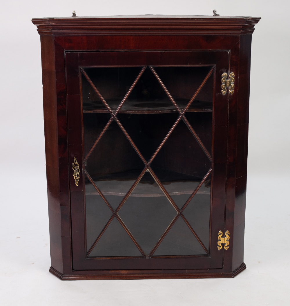 ANTIQUE FLAT FRONTED GLAZED MAHOGANY CORNER CUPBOARD, with exposed brass butterfly hinges, fancy