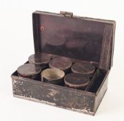 NINETEENTH CENTURY BLACK JAPANNED METAL SPICE BOX, containing six spice tins, the lids marked in