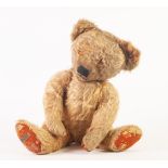 MERRYTHOUGHT MID TWENTIETH CENTURY GOLDEN PLUSH TEDDY BEAR, with swivel head and limbs, glass eyes