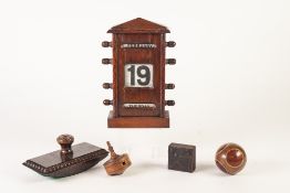 CIRCA 1920's OAK CASED PERPETUAL DESK CALENDAR, with printed fabric rolls for day, date and month,
