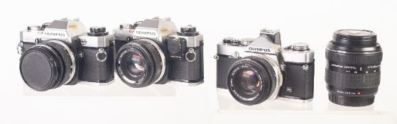 THREE OLYMPUS 35mm SLR ROLL FILM CAMERAS, comprising: TWO OM10's, and an OM1, all fitted with