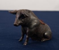 VICTORIAN SPELTER PIN CUSHION in the form of a well modelled seated pig, 3" high, 5" long