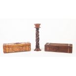 EARLY TWENTIETH CENTURY CARVED WOOD BOX, modelled as a travel trunk with leather straps, the