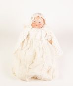 A SMALL EARLY TWENTIETH CENTURY ARMAND MARSEILLE BISQUE HEAD BABY DOLL with sleeping blue eyes and