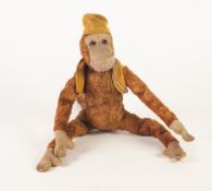 PROBABLY GERMAN PRE WAR FELT FABRIC AND PLUSH MONKEY TOY, with long wired limbs and tail, glass eyes