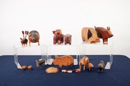 FIFTEEN WOODEN PIG ORNAMENTS AND ITEMS AND A WICKERS PIG SHAPED LIDDED RECEIVER (16)